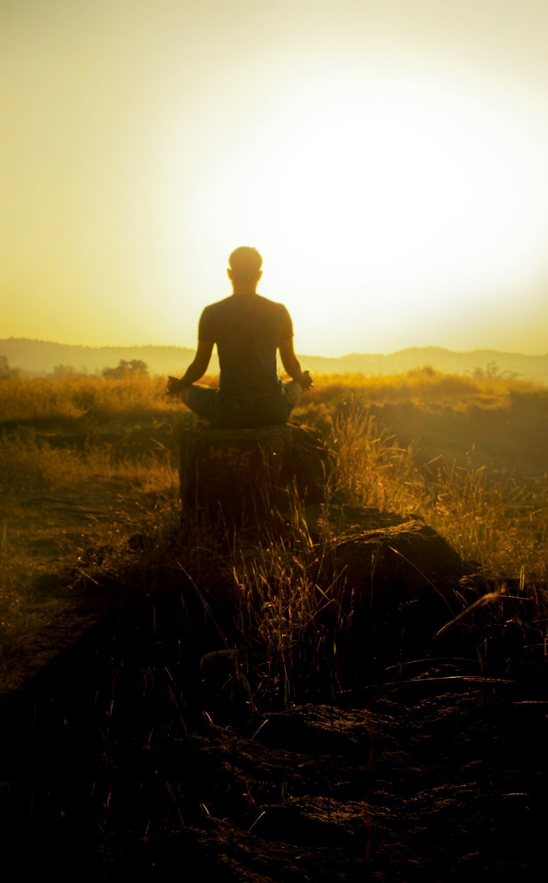 person meditating alone